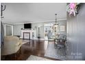 Bright living room featuring hardwood floors and a fireplace at 104 E Main St, Cleveland, NC 27013