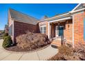 Brick home entrance with a walkway and landscaping at 1117 Butterburr Dr, Matthews, NC 28104