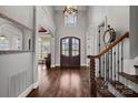 Grand entryway with hardwood floors and elegant staircase at 19107 Wildcat Trl, Davidson, NC 28036