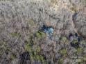 Aerial view showing house nestled in a wooded area at 209 Meadowridge Dr, Maiden, NC 28650