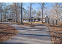 House exterior featuring a carport and long driveway at 209 Meadowridge Dr, Maiden, NC 28650