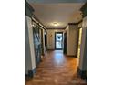 Bright and spacious entryway with hardwood floors and barn door at 249 Planters Row Rd, Iron Station, NC 28080