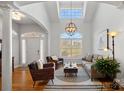 Bright living room with hardwood floors and vaulted ceilings at 2635 Queens Dr, Lincolnton, NC 28092