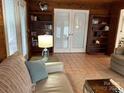 Cozy living room with built-in shelves and tiled floor at 273 Leeward Point Loop, Taylorsville, NC 28681