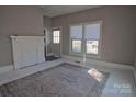 Living room with whitewashed floors, fireplace and rug at 303 N Gaston St, Kings Mountain, NC 28086