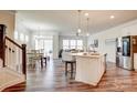 Open concept kitchen with island, stainless steel appliances, and white cabinets at 3936 Rothwood Ln, Harrisburg, NC 28075