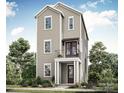 Three-story home with light beige siding, dark brown doors, and a balcony at 425 Delburg Mill Alley Dr, Davidson, NC 28036