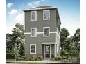 Three-story home with gray siding, white trim, and a brick base at 429 Delburg Mill Alley Dr, Davidson, NC 28036