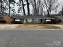 Front view of a triplex with a shared driveway at 5009 Highlake Dr, Charlotte, NC 28215