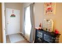 Bright entryway with a white door and large window for natural light at 5375 Josephine Sw Ln, Concord, NC 28027