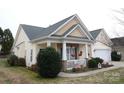 House exterior featuring a light yellow ranch home with a covered porch at 5375 Josephine Sw Ln, Concord, NC 28027