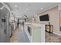 Well-lit kitchen with a central island, modern appliances, ample counter space, and seamless flow to the living area at 645 Honey Dew Ln, Fort Mill, SC 29715