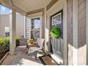 Cozy front porch with seating, a decorative wreath, and a welcoming entrance, perfect for relaxing outdoors at 645 Honey Dew Ln, Fort Mill, SC 29715