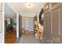 Bright entryway with hardwood floors, console table, and view of living room at 6511 Newhall Rd, Charlotte, NC 28270