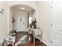 Bright entryway with hardwood floors and decorative accents at 6908 Agava Ln, Charlotte, NC 28215