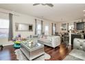 Open living room featuring hardwood floors and a sectional sofa at 6908 Agava Ln, Charlotte, NC 28215