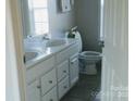 Double vanity bathroom with toilet and shower at 74 Noble Cir, Wadesboro, NC 28170