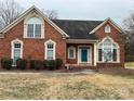 Attractive brick home with landscaping and a well-maintained lawn at 7925 Tottenham Dr, Harrisburg, NC 28075