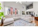 Spacious living room featuring a large sectional sofa and high ceilings at 9112 Meadowmont View Dr, Charlotte, NC 28269