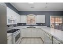 White kitchen cabinets, stainless steel appliances at 9261 Meadow Vista Rd, Charlotte, NC 28213