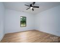 Bright bedroom with light hardwood floors and large window at Lot 1 Hoke W St, Landis, NC 28088