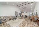 Spacious living room with an open floor plan, vaulted ceilings, and lots of natural light, blending into the kitchen at 1076 Furnace Rd, Iron Station, NC 28080
