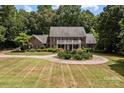 Brick house with circular driveway and lush green lawn at 210 W Glenview Dr, Salisbury, NC 28147