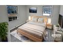 Virtually staged bedroom with light wood furniture and large windows at 2804 Lyndell Way, Lancaster, SC 29720