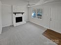 Living room featuring a fireplace and neutral carpeting at 2804 Lyndell Way, Lancaster, SC 29720