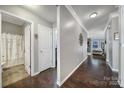 Bright hallway with hardwood floors and access to bathroom at 5803 Mcclintock Dr, Denver, NC 28037