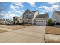 Attractive two-story home with a spacious driveway leading to an attached two-car garage at 630 Daventry Ct, Clover, SC 29710