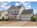 Lovely two-story home with a two-car garage and a well-kept lawn and driveway at 630 Daventry Ct, Clover, SC 29710