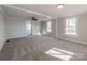 Bright living room with new carpet and ceiling fan at 701 Hiddenite Church Rd, Hiddenite, NC 28636