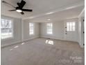 Living room featuring hardwood floors and lots of natural light at 701 Hiddenite Church Rd, Hiddenite, NC 28636