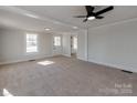 Spacious living room with hardwood floors and natural light at 701 Hiddenite Church Rd, Hiddenite, NC 28636