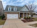Brick and siding home with a two-car garage at 867 Pecan Tree Ln, Fort Mill, SC 29715