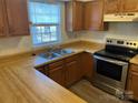 Galley kitchen with stainless steel appliances at 10006 White Cascade Dr, Charlotte, NC 28269