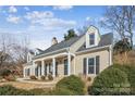 Attractive house with a covered porch and landscaping at 1011 Jaywood Ln, Matthews, NC 28105