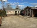 Cute cottage, detached garage, and ample parking at 105 Richard Dr, New London, NC 28127