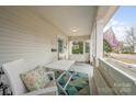 Inviting front porch features a swing, table, and chairs for relaxing outdoors at 132 N Confederate Ave, Rock Hill, SC 29730