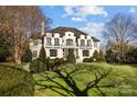 Elegant home with a large front yard and mature trees at 413 Eastover Rd, Charlotte, NC 28207
