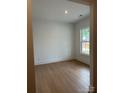 Bright, clean bedroom with hardwood floors and a window with outside view at 5213 Mint Harbor Way # 0351, Charlotte, NC 28269