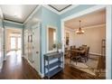 Bright entryway with hardwood floors and view into dining room at 724 Mercer Pl, Huntersville, NC 28078