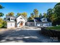 Two-story home with attached garage and attractive landscaping at 115 Cloverhill Rd, Mooresville, NC 28117