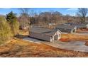 Aerial view of a newly built gray house and neighboring houses at 1443 Southwest Blvd, Newton, NC 28658