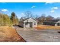 Newly built gray house with a long concrete driveway at 1443 Southwest Blvd, Newton, NC 28658