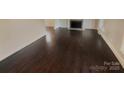 Dark hardwood floors in spacious living room at 1601 Lyndale Pl, Charlotte, NC 28210