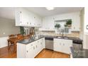 Traditional kitchen with white cabinets, granite countertops, and stainless steel appliances at 330 Regency Rd, Salisbury, NC 28147