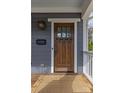 Elegant craftsman front door with glass panes and a welcoming entryway at 3319 Holt St, Charlotte, NC 28205