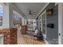 Inviting front porch features a ceiling fan and comfortable seating area at 3319 Holt St, Charlotte, NC 28205